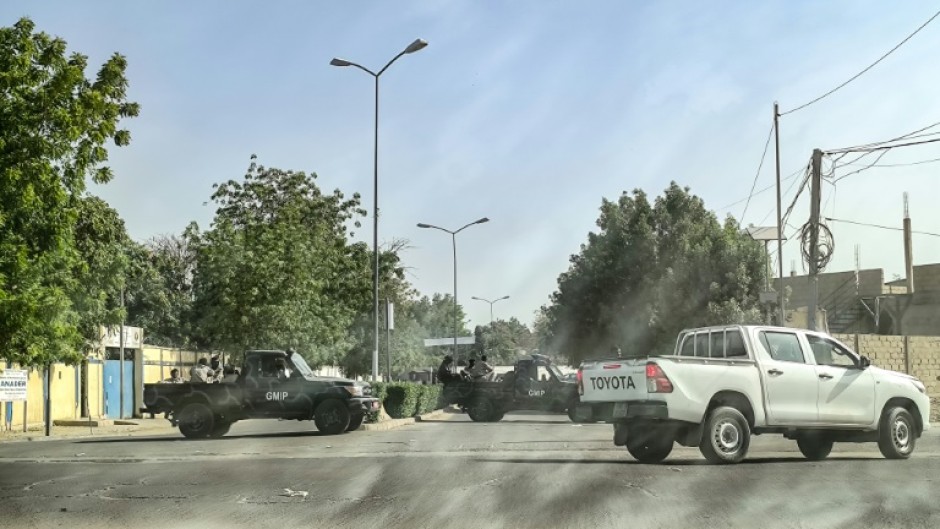 Chadian soldiers block the road leading to the headquarters of the opposition Socialist Party Without Borders' where  leader Yaya Dillo died during an army assault