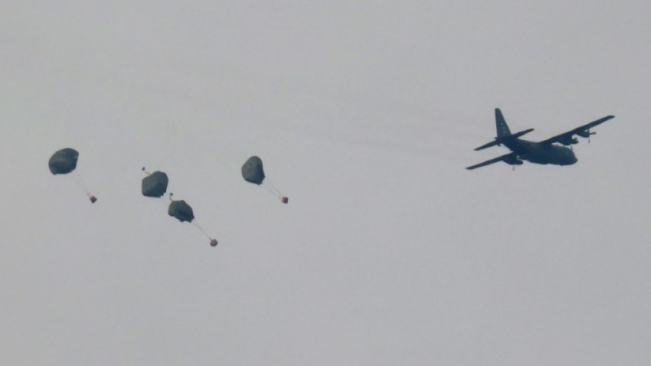 A Jordanian military aircraft drops humanitarian aid over Rafah 