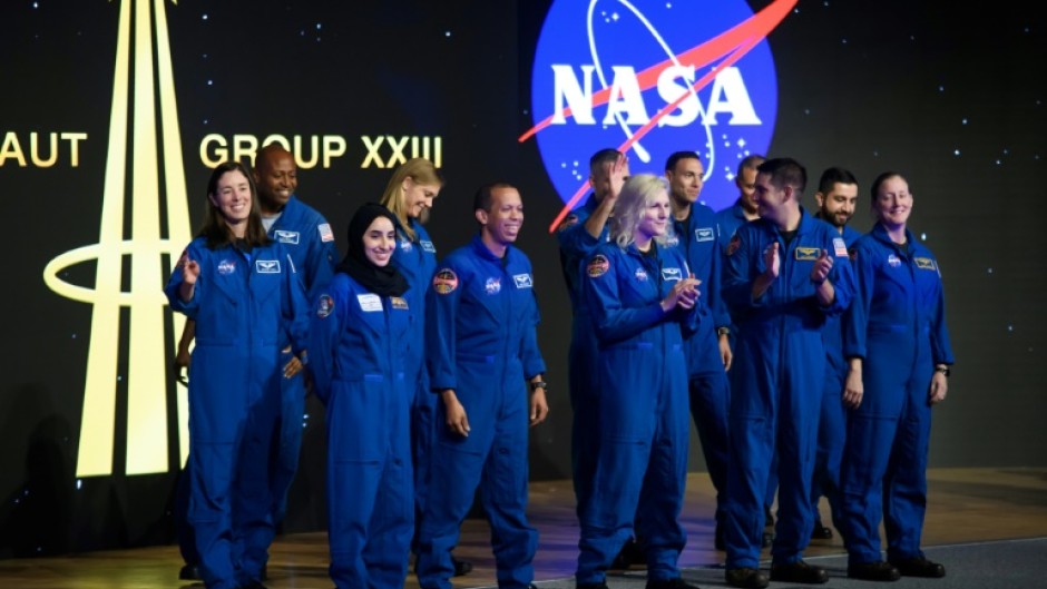 Astronaut graduates from the United States and United Arab Emirates during a ceremony at the NASA Johnson Space Center