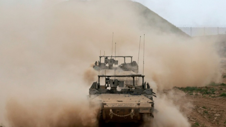 Israeli army vehicles rolling out of Gaza on March 3, 2024, amid the ongoing battles between Israel and Hamas