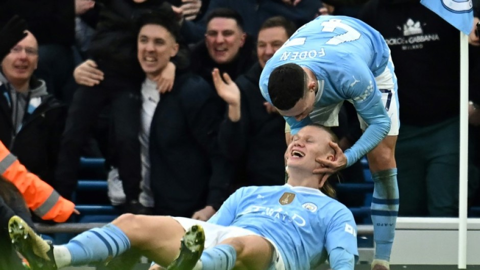 Erling Haaland (centre) and Phil Foden (right) scored in Manchester City's 3-1 win over Manchester United