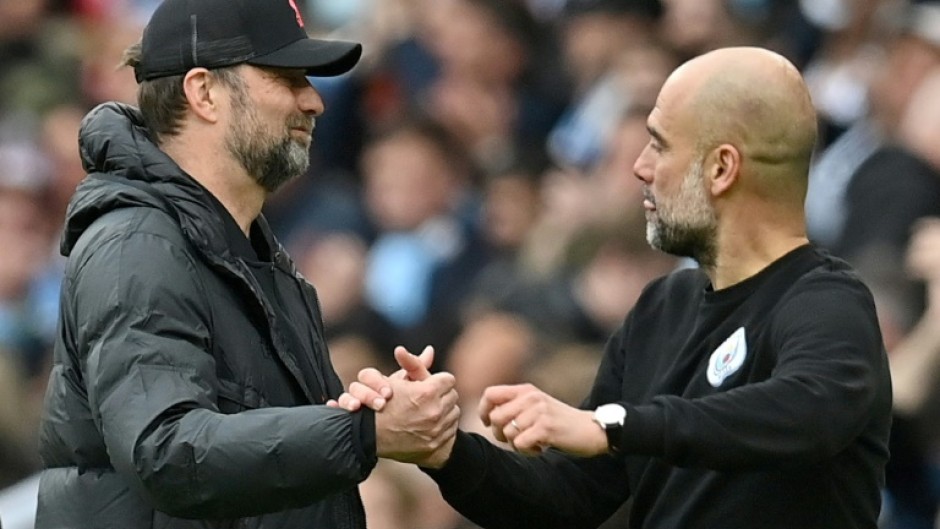 Jurgen Klopp (left) is preparing to pit his wits against Pep Guardiola 