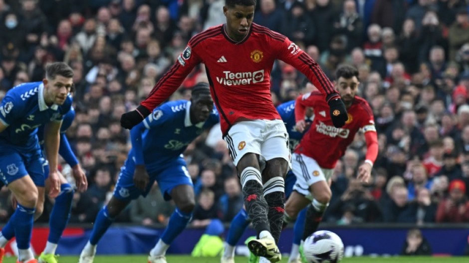 Spot on: Marcus Rashford (centre) scored Manchester United's second goal against Everton