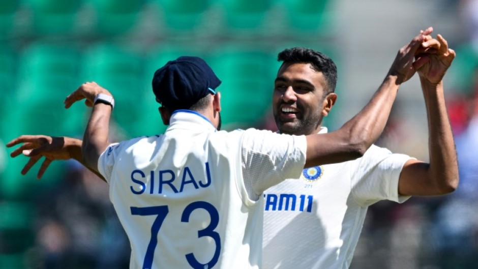 Off-spinner Ravichandran Ashwin (R) returned figures of 5-77 to help bowl out England for 195 inside three days at the picturesque Dharamsala stadium