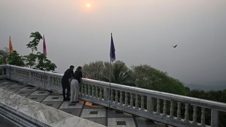 Thai tourist hotspot Chiang Mai was blanketed by hazy smog Friday, as residents and visitors to the usually picturesque northern city were left wheezing in the toxic air