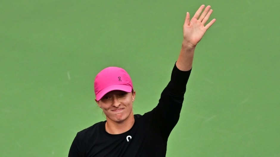 Poland's Iga Swiatek acknowledges the fans after defeating Ukraine's Marta Kostyuk in the semi-finals of the ATP-WTA Indian Wells Masters