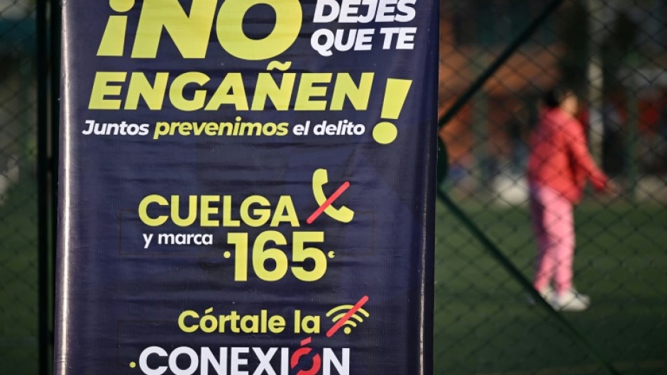 A poster in a crime-hit neighborhood of Bogota, urging people to report extortion attempts 