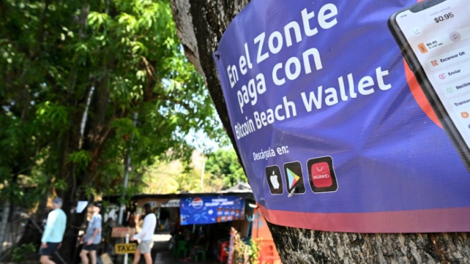 A sign promoting bitcoin transactions is seen in the beach town of El Zonte in El Salvador