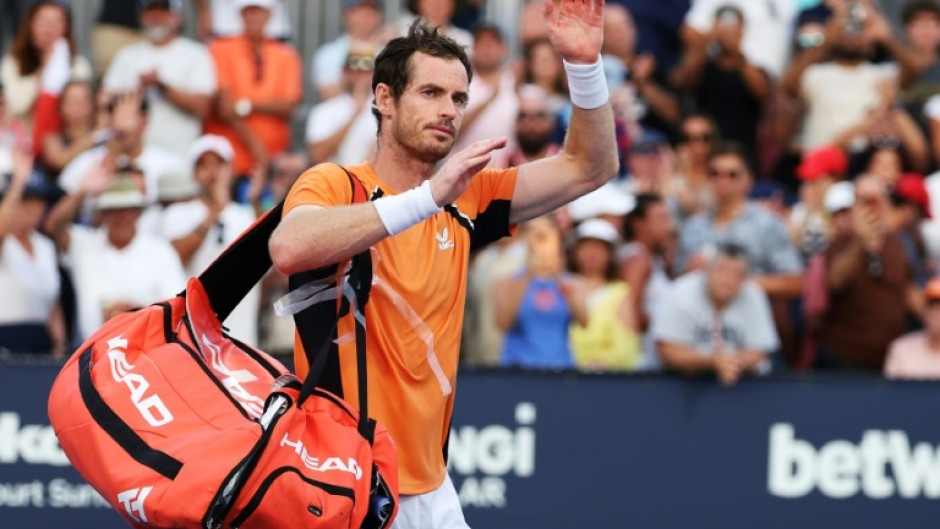 Andy Murray of Great Britain waves to the crowd after losing in three sets against Tomas Machac of the Czech Republic at the Miami Open on Sunday.