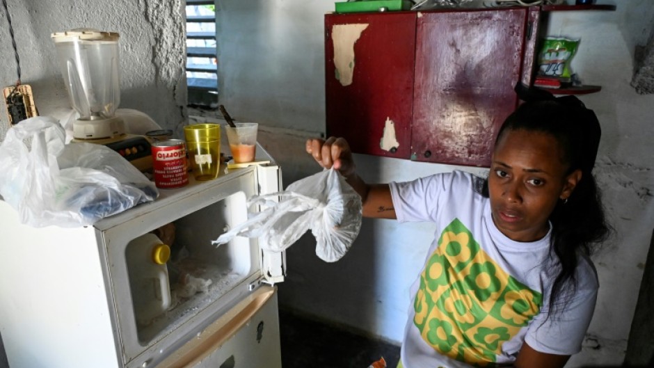 Diana Ruiz and her nearly empty refrigerator, photographed in Havana on March 27, 2024 