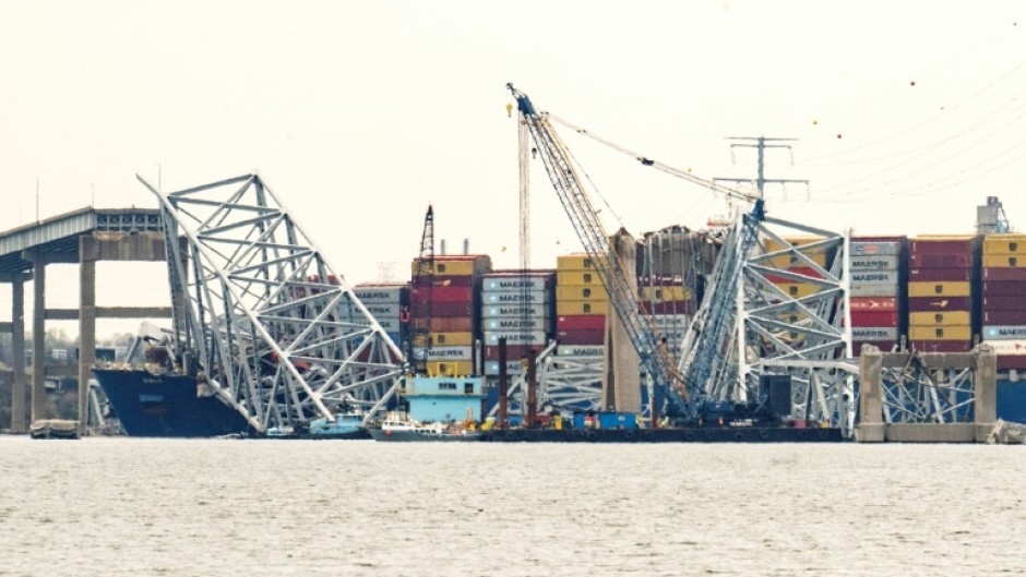 The container ship Dali is seen pinned under fallen wreckage of the Francis Scott Key Bridge in Baltimore, Maryland on March 30, 2024 