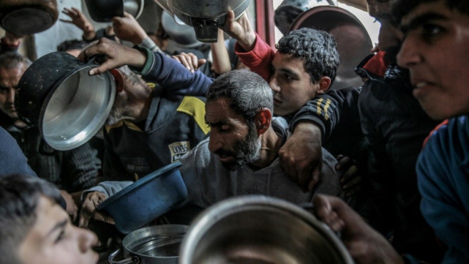 Palestinians jostled to obtain food aid in February in the northern Gaza Strip, where an estimated 70 percent of people face famine conditions