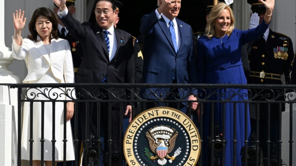 (L-R) Yuko Kishida, her husband Japanese Prime Minister Fumio Kishida, US President Joe Biden and First Lady Jill Biden wave from the Truman Balcony during an Official Arrival Ceremony on the South Lawn of the White House in Washington, DC, April 10, 2024.