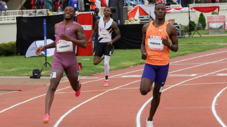 Courtney Lindsey (left) and Letsile Tebogo cross the line in an identical time in the men's 200m in Nairobi