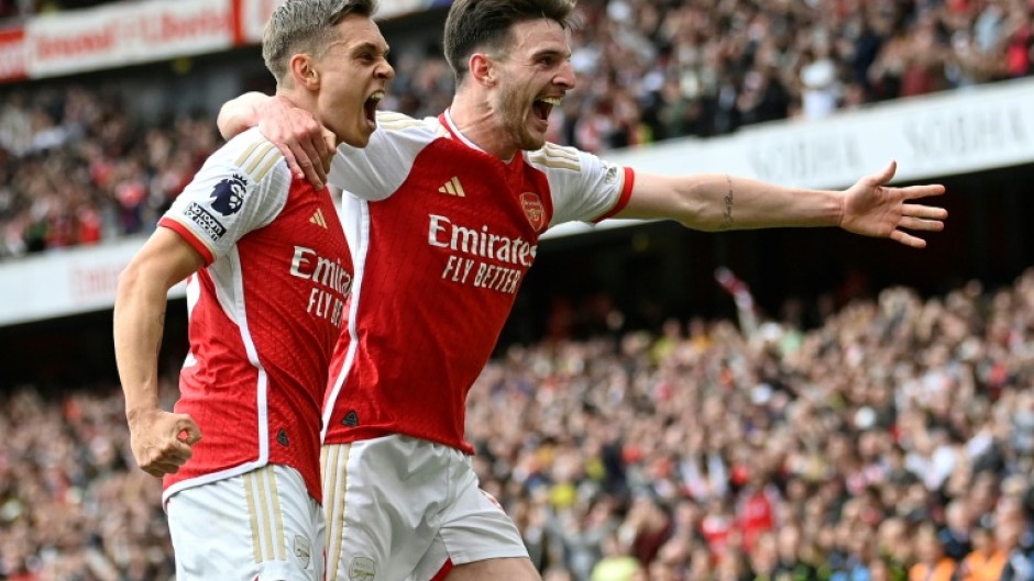 Arsenal's Leandro Trossard (L) and Declan Rice celebrate against Bournemouth