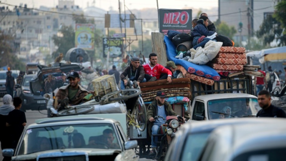 Displaced Palestinians flee Rafah for safer areas on May 7, 2024