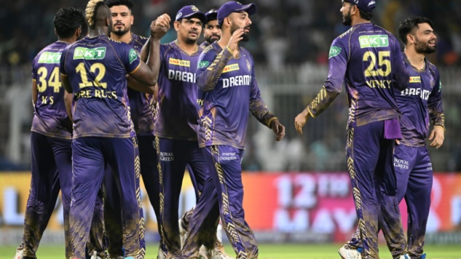 Kolkata Knight Riders became the first team to book their play-off spot in the IPL with victory over Mumbai Indians