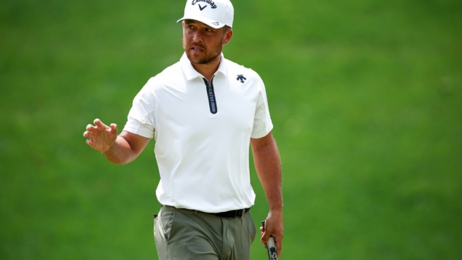 Xander Schauffele fired a four-under par 67 to grab the lead at the storm-hit PGA Wells Fargo Championship