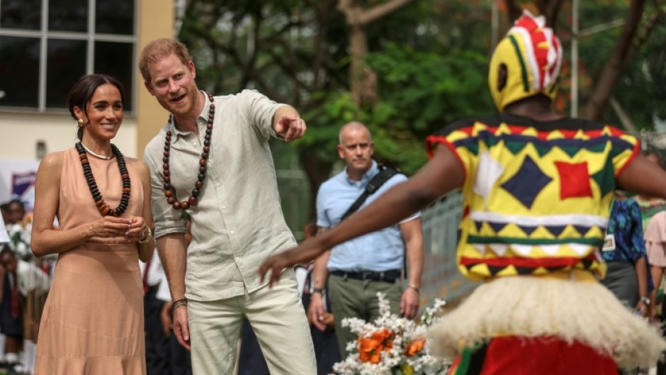 The couple were greeted at a school in Abuja by a drum and dance group from the Igbo ethnic group