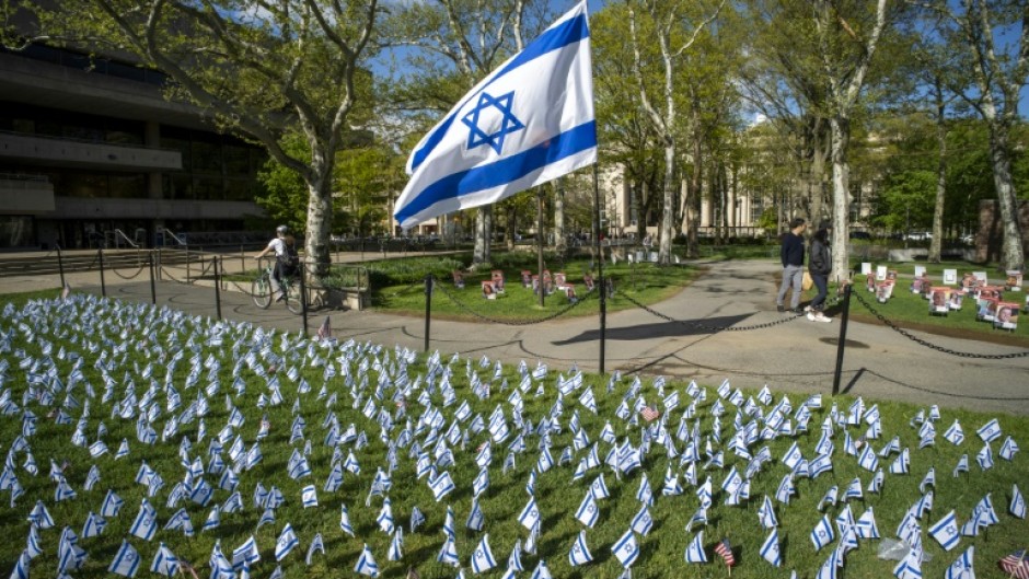 Israeli flags are pictured in front of a pro-Palestinian encampment (out of frame) on the lawn of the Stratton Student Center campus at the Massachusetts Institute of Technology (MIT) in Cambridge, Massachusetts, on May 9, 2024