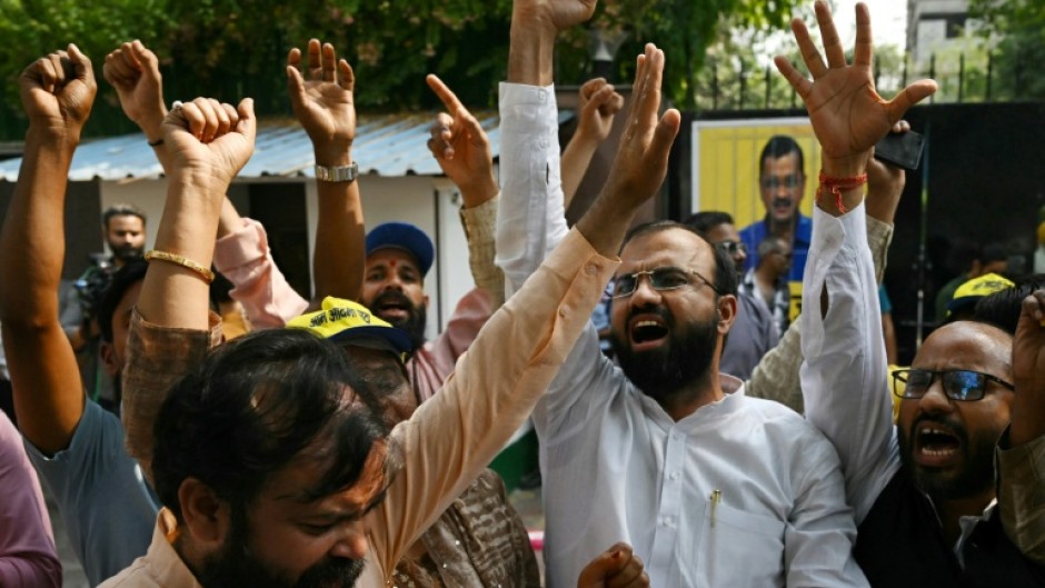 Crowds gathered at the headquarters of Kejriwal's Aam Aadmi Party after the ruling to celebrate his impending release with the customary distribution of sweets