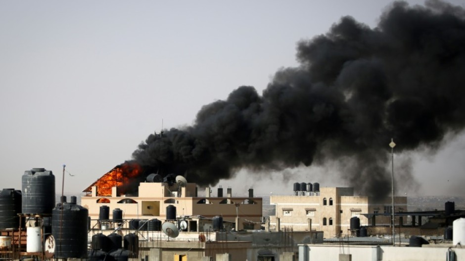 Smoke rises from a fire after Israeli bombardment in Rafah, whose eastern sector Israeli troops have entered despite international objections