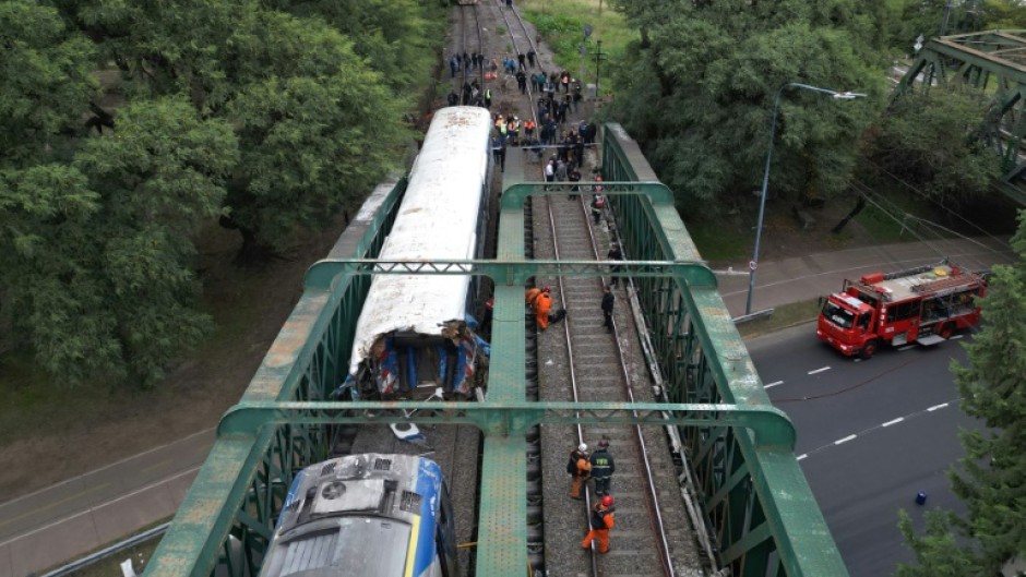 Aerial view of emergency crew members working on a train crash site in Buenos Aires on May 10, 2024