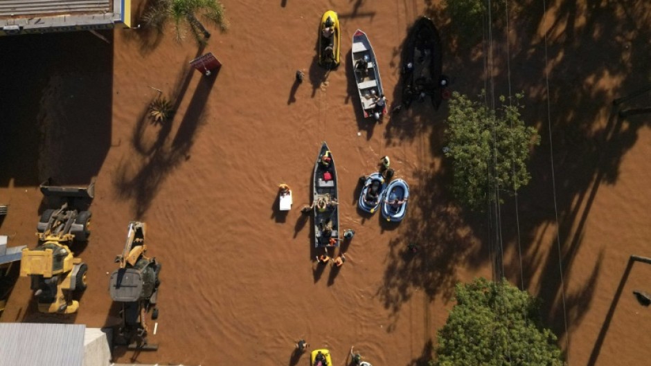 Historic levels of rainfall and flooding in southern Brazil, such as seen in this aerial view over Porto Alegre on May 6, 2024, have fueled a spate of conspiracy theories