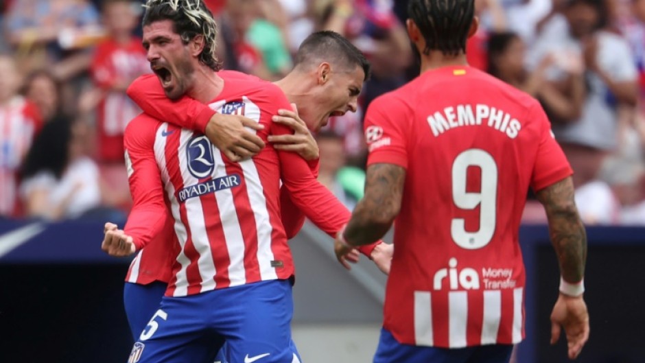 Atletico Madrid midfielder Rodrigo De Paul (L) celebrates his fine strike to earn his team victory against Celta Vigo