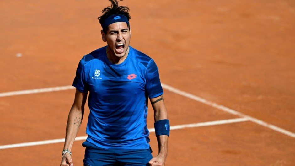 Alejandro Tabilo celebrates after winning against China's Zhang Zhizhen in the Rome Open quarter-finals