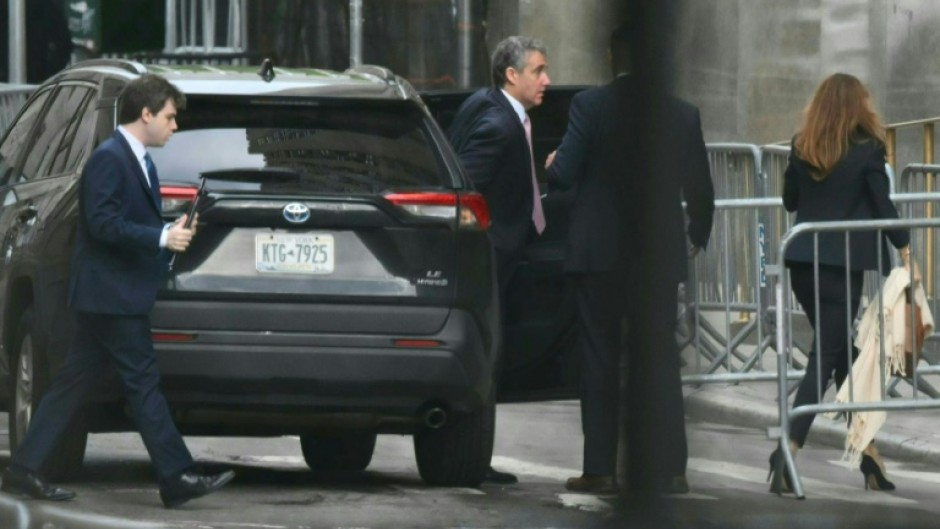 Former Trump attorney Michael Cohen (C) arrives at Manhattan Criminal Court for the trial of former US President Donald Trump for allegedly covering up hush money payments linked to extramarital affairs