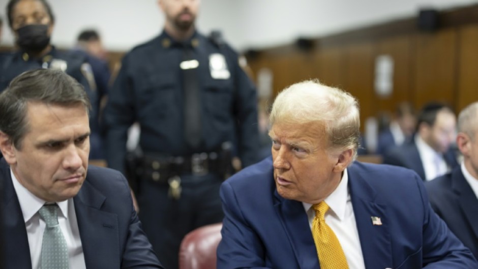 Former US President Donald Trump, with lawyer Todd Blanche (L) attends his ongoing criminal trial in Manhattan