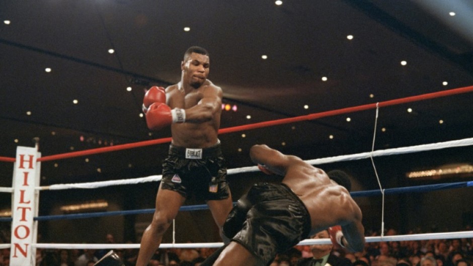 Mike Tyson floors Trevor Berbick in the second round in 1986 to become the youngest world heavyweight champion