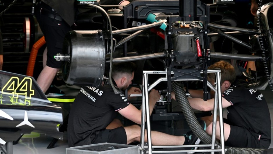 Work it out: Mechanics work on the Mercedes of Lewis Hamilton