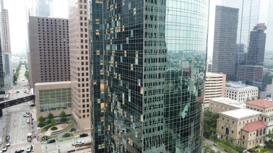 Shattered windows are seen on buildings in downtown Houston on May 17, 2024, one day after the city was hit by severe storms