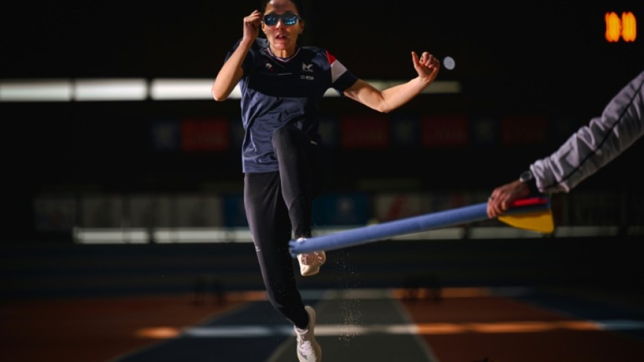 Delya Boulaghlem, a French visually handicapped sprinter and long jumper, takes part in a training session in preparation for the Paris Paralympics