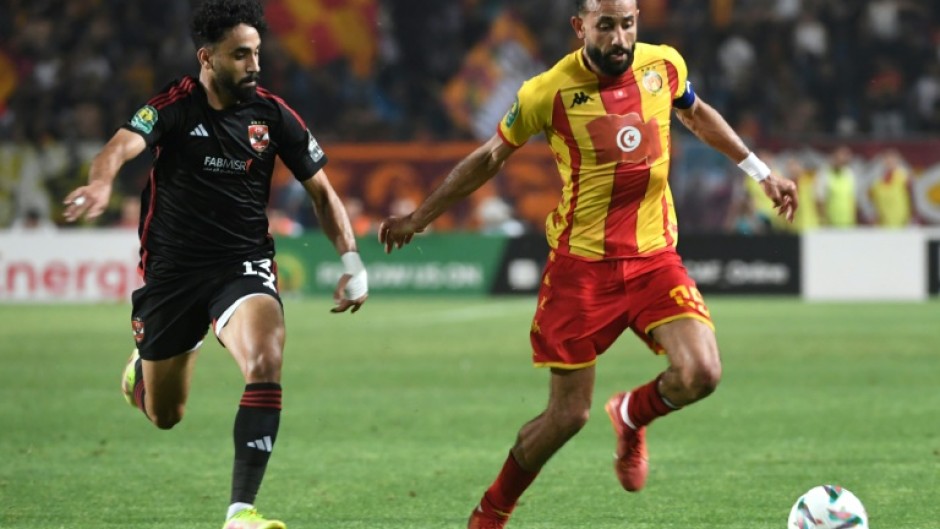 Marwan Attia (L) of Al Ahly challenges Ghaylene Chaalali of Esperance during the first leg of the 2024 CAF Champions League final in Tunisia. 