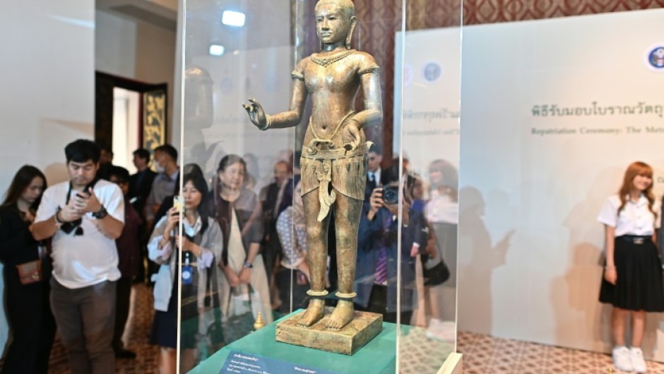 A 900-year-old statue smuggled out of Thailand was welcomed back to the kingdom in an official repatriation ceremony in Bangkok