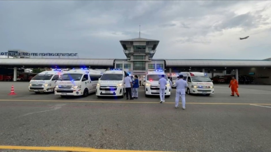 Medical staff gather at Suvarnabhumi Airport in Bangkok after a Singapore Airlines flight hit severe turbulence and was forced to make an emergency landing