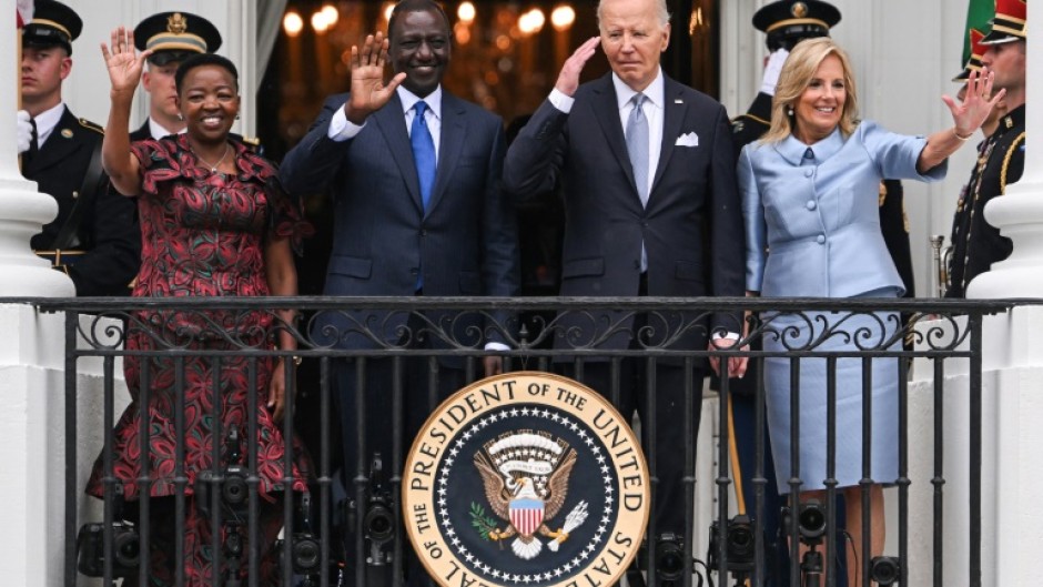 (L-R) First Lady Rachel Ruto of Kenya, Kenyan President William Ruto, US President Joe Biden and First Lady Jill Biden wave to the crowd during an official arrival ceremony on the South Lawn of the White House in Washington, DC, on May 23, 2024