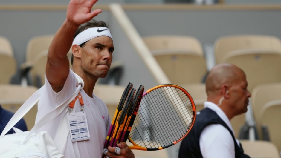 'Give my all': Rafael Nadal waves to spectators as he leaves the court after taking part in a practice session at the French Open