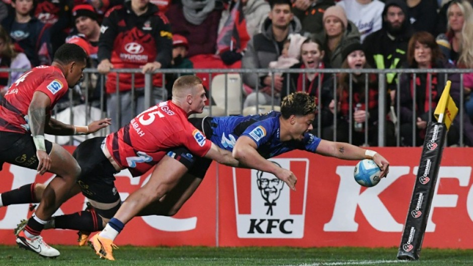 Blues winger AJ Lam scores a try but the Canterbury Crusaders fought back to score an upset 29-27 win in a Super Rugby Pacific quarter-final