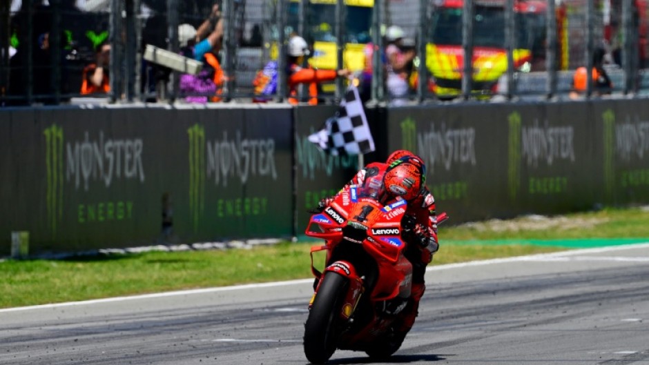 Ducati rider Francesco Bagnaia crosses the finish line in first place at the Catalunya MotoGP on Sunday