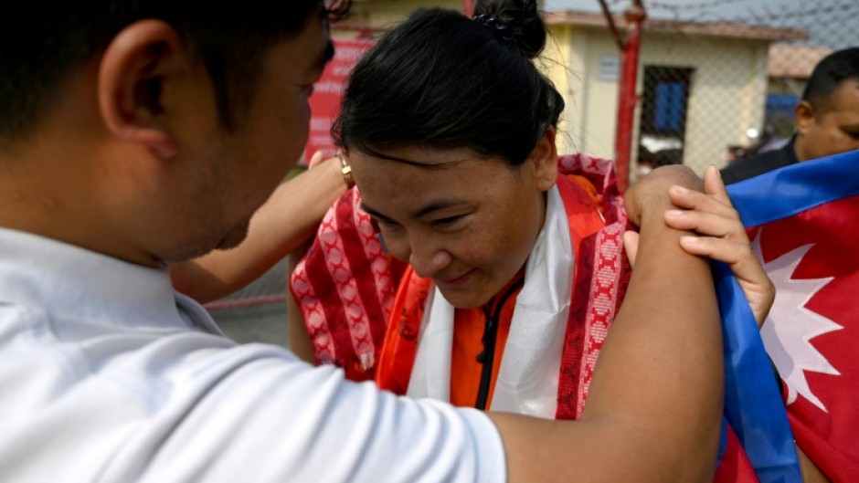 Nepali mountaineer Phunjo Lama, who clinched the record for the fastest ascent of Mount Everest by a woman, is greeted upon her arrival in Kathmandu