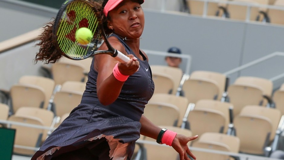 Power-packed: Naomi Osaka plays a forehand to Lucia Bronzetti 