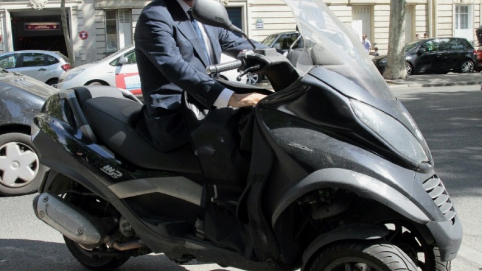 Candidate for the French Socialist Party 2012 primary elections, Francois Hollande is pictured on his scooter in Paris in 2011