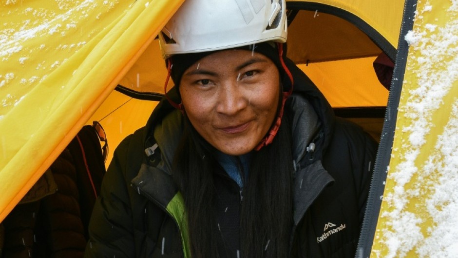 Nepal's Phunjo Lama smashed the record for the fastest ascent of Everest by a woman, conquering the world's highest mountain in 14 hours and 31 minutes