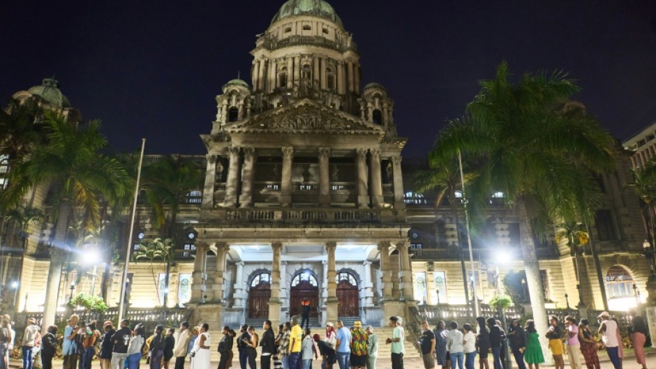 Voters queued long into the night after stations were overwhelmed by the high turnout 