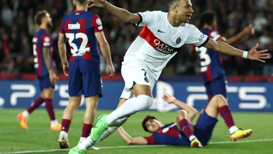 Paris Saint-Germain's French forward Kylian Mbappe netted twice against Barcelona at Montjuic in the Champions League