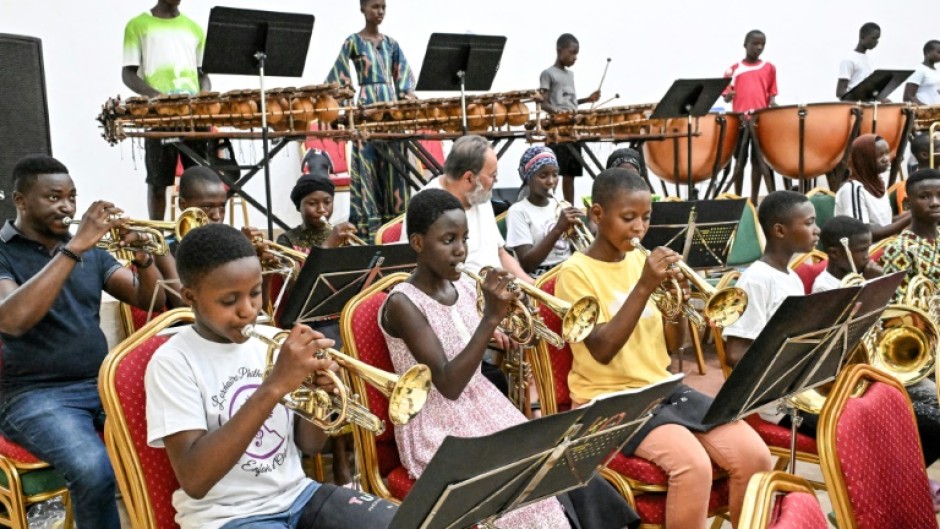 Children from a rural town in Ivory Coast have been brought together to play in a philharmonic orchestra